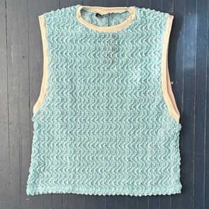 Sky blue sleeveless mesh textured top with ivory trim